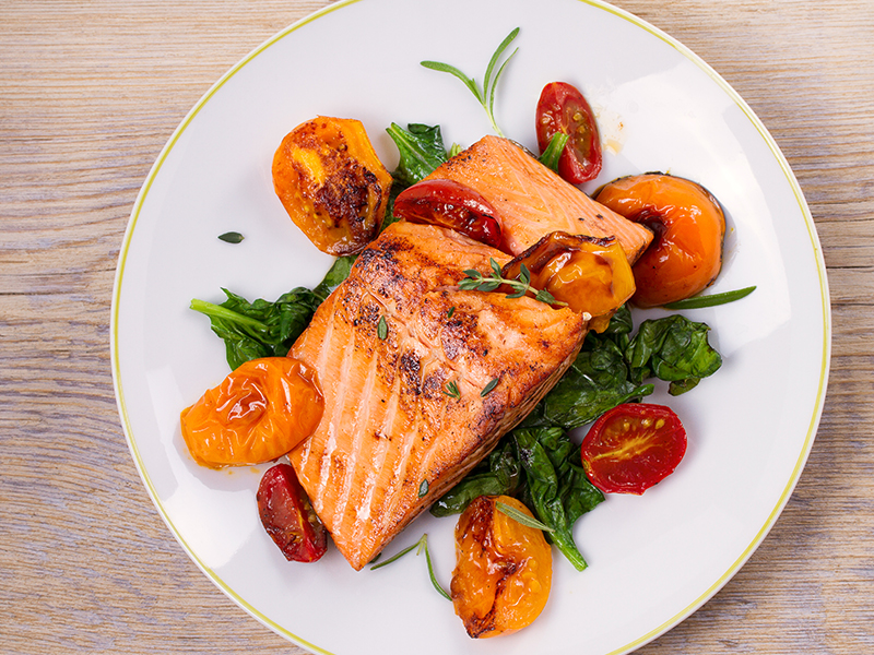 Balsamic-glazed sesame salmon with spicy cherry tomatoes and spinach